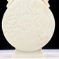 An exquisite white jade elephant ear vase with flower and bird patterns and lid