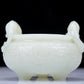 A Precious White Jade 'Dragon' Tripod Censer. Carved with archaistic motifs. Chinese Qing Dynasty. Size:11cmx7.5cm. Weight:400g     清代 白玉龙纹双耳三足炉