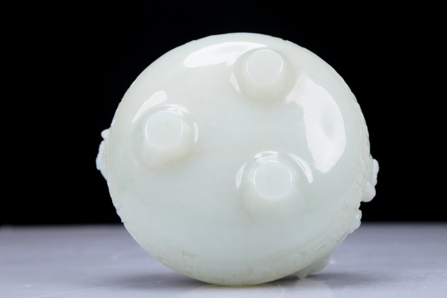 A Precious White Jade 'Dragon' Tripod Censer. Carved with archaistic motifs. Chinese Qing Dynasty. Size:11cmx7.5cm. Weight:400g     清代 白玉龙纹双耳三足炉