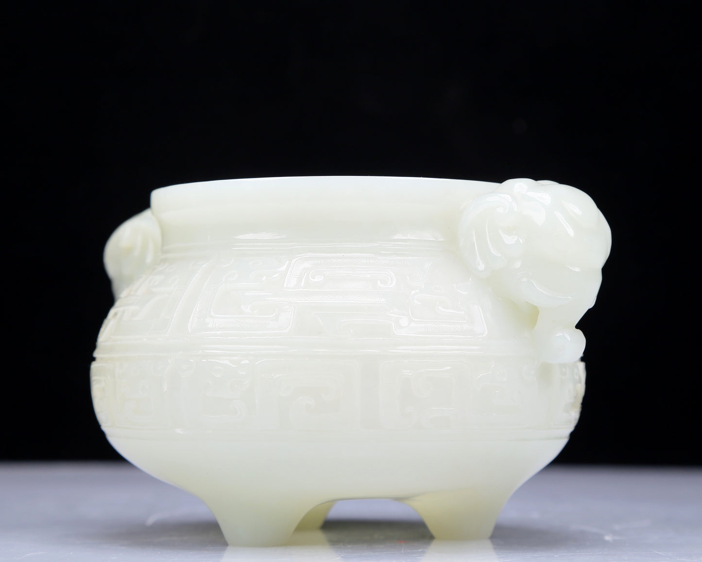 A Precious White Jade 'Animal Mask' Elephant-Handled Tripod Censer