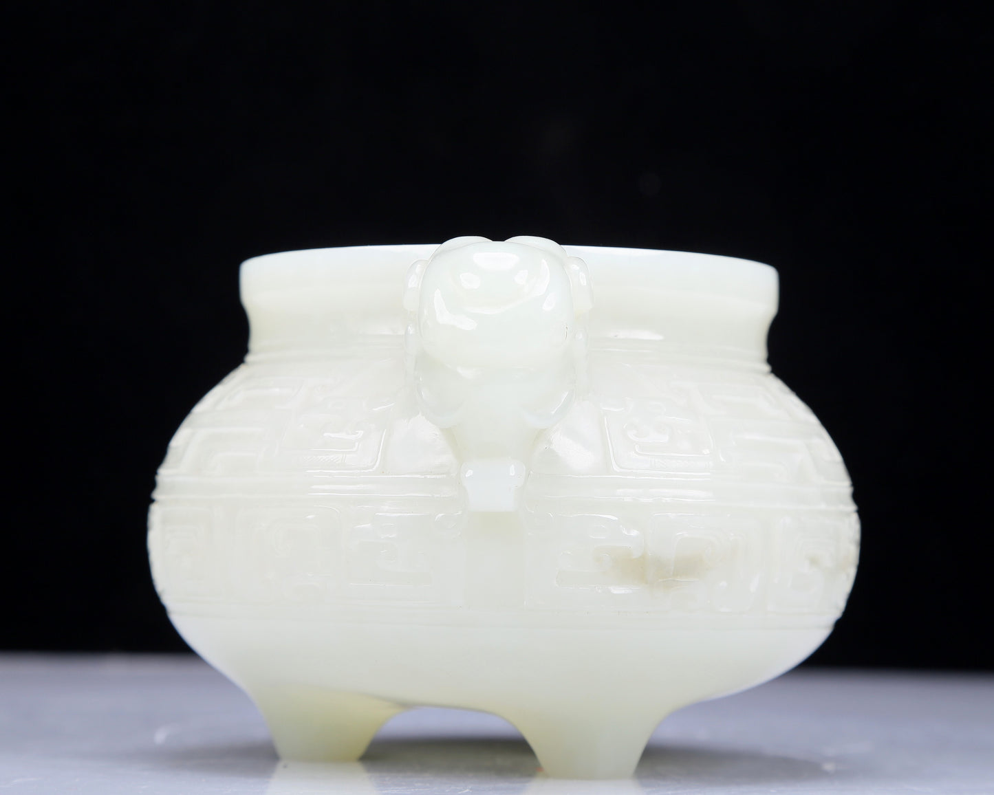 A Precious White Jade 'Animal Mask' Elephant-Handled Tripod Censer