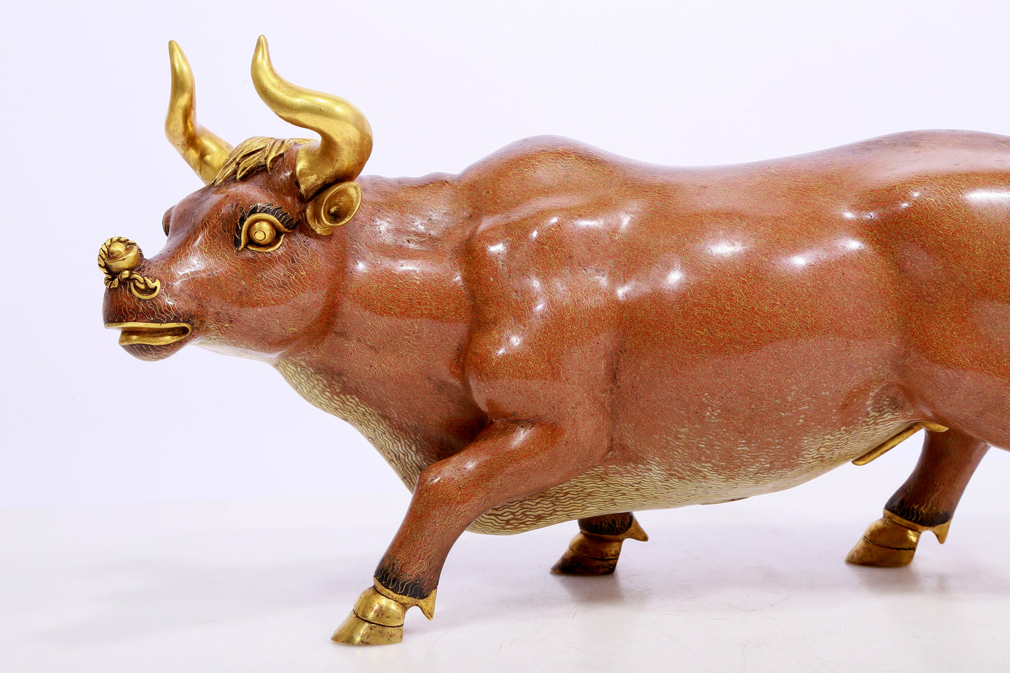 A cloisonné cow ornament