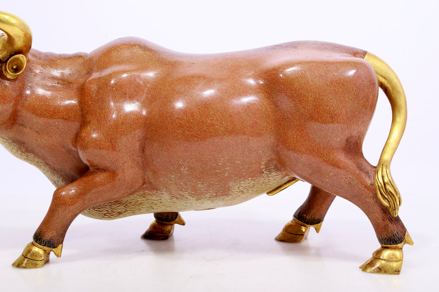 A cloisonné cow ornament