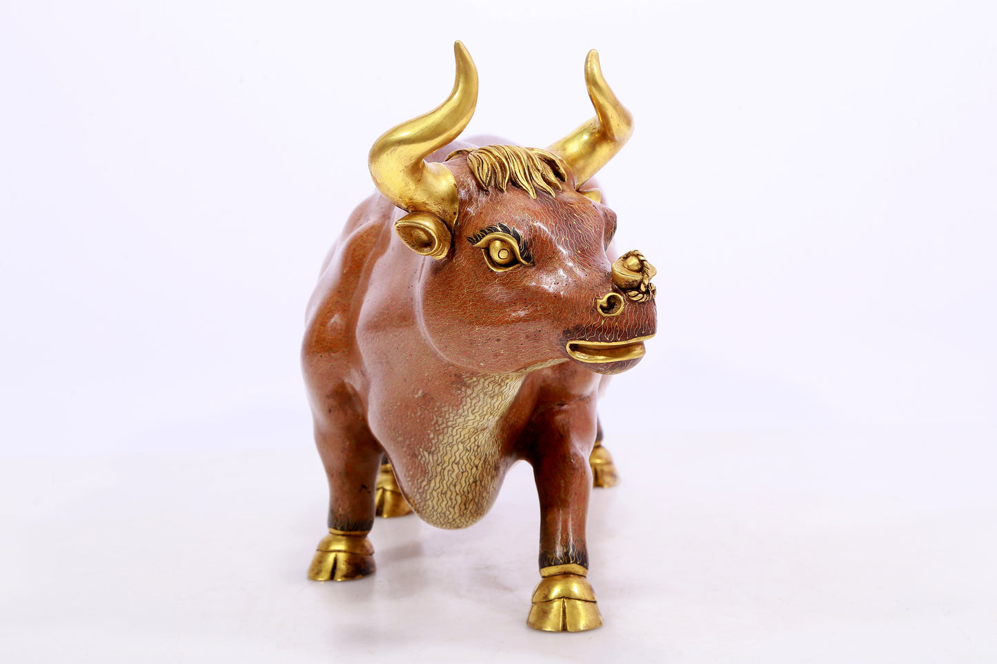 A cloisonné cow ornament