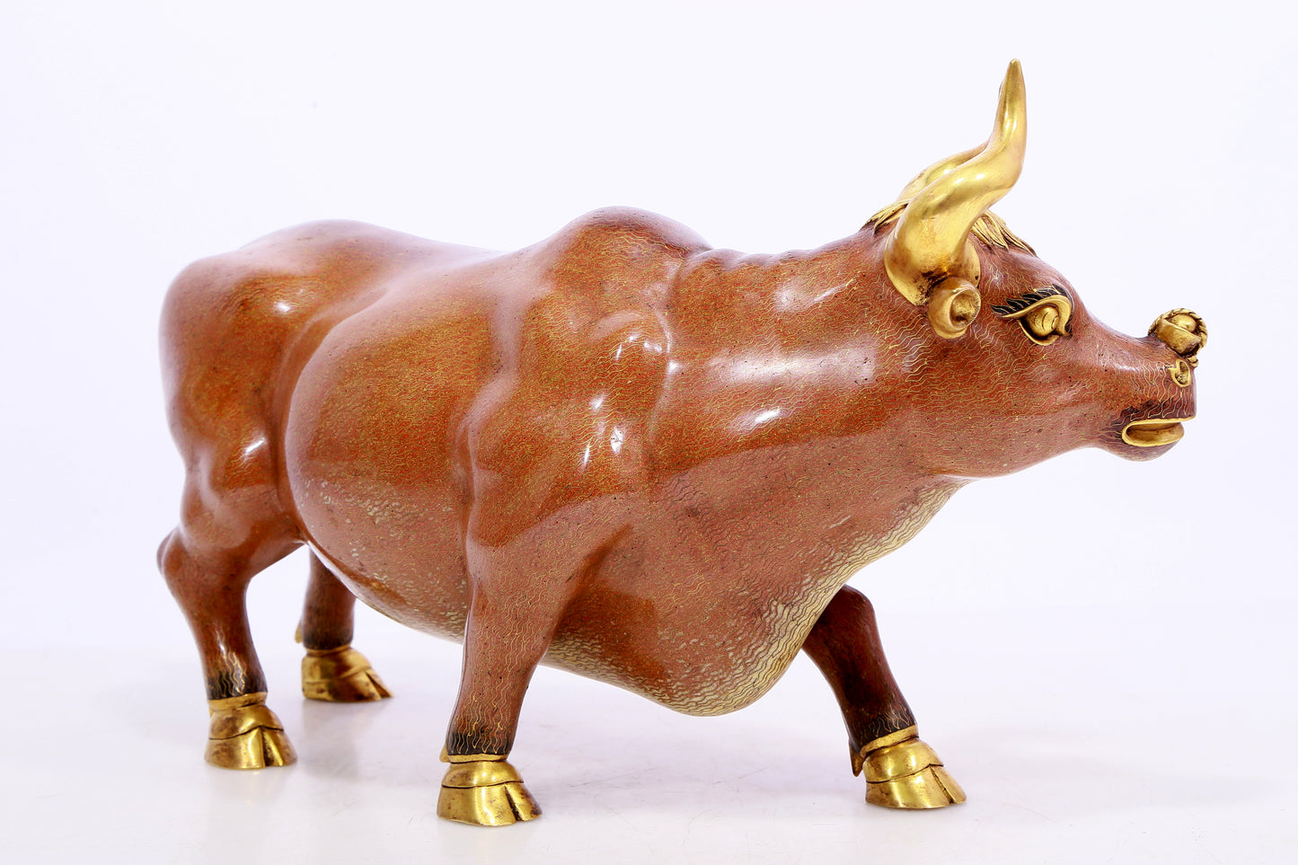 A cloisonné cow ornament