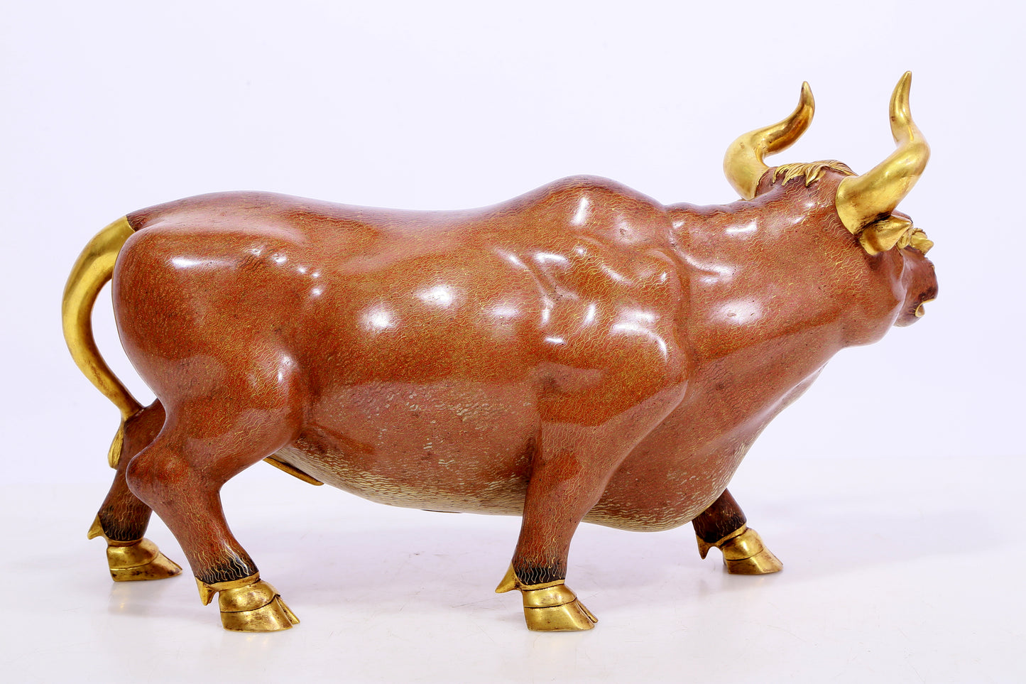 A cloisonné cow ornament