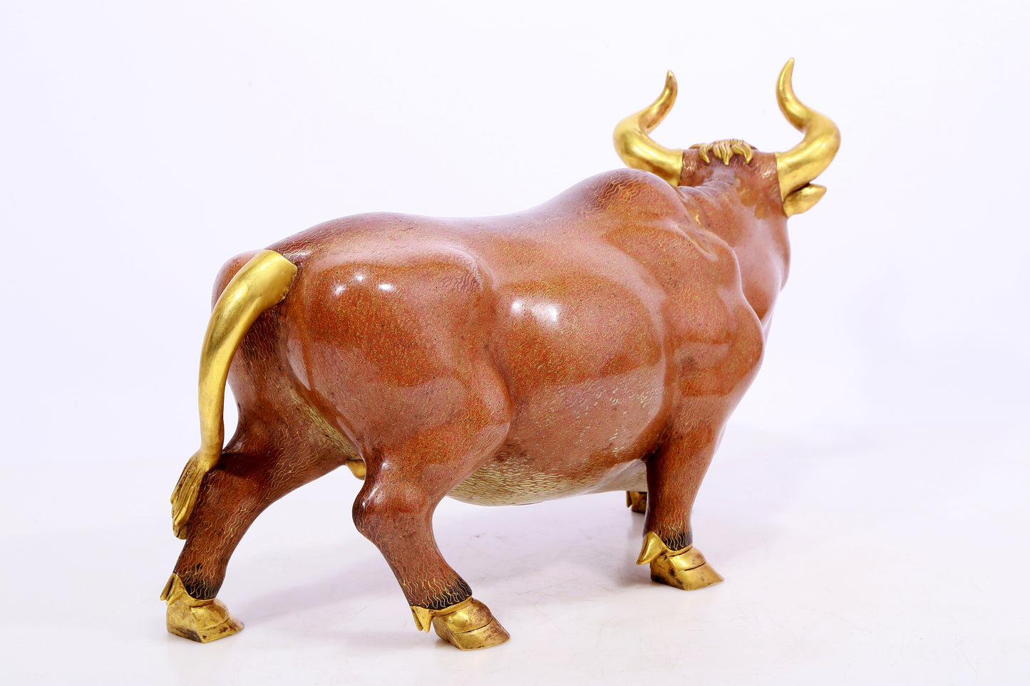 A cloisonné cow ornament