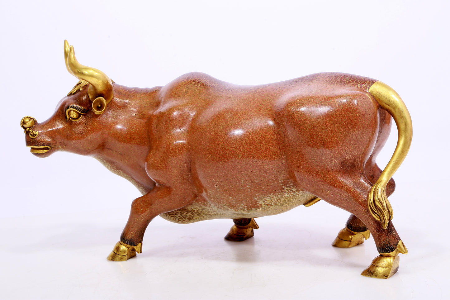 A cloisonné cow ornament