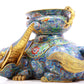 A pair of cloisonné elephant ornaments