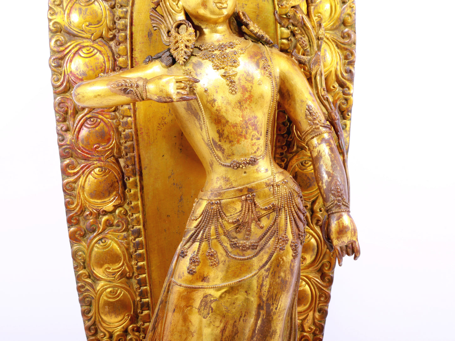 A solemn gilt bronze statue of Tara