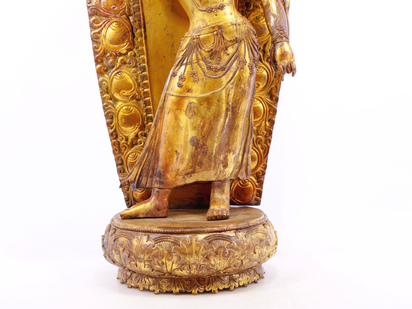 A solemn gilt bronze statue of Tara