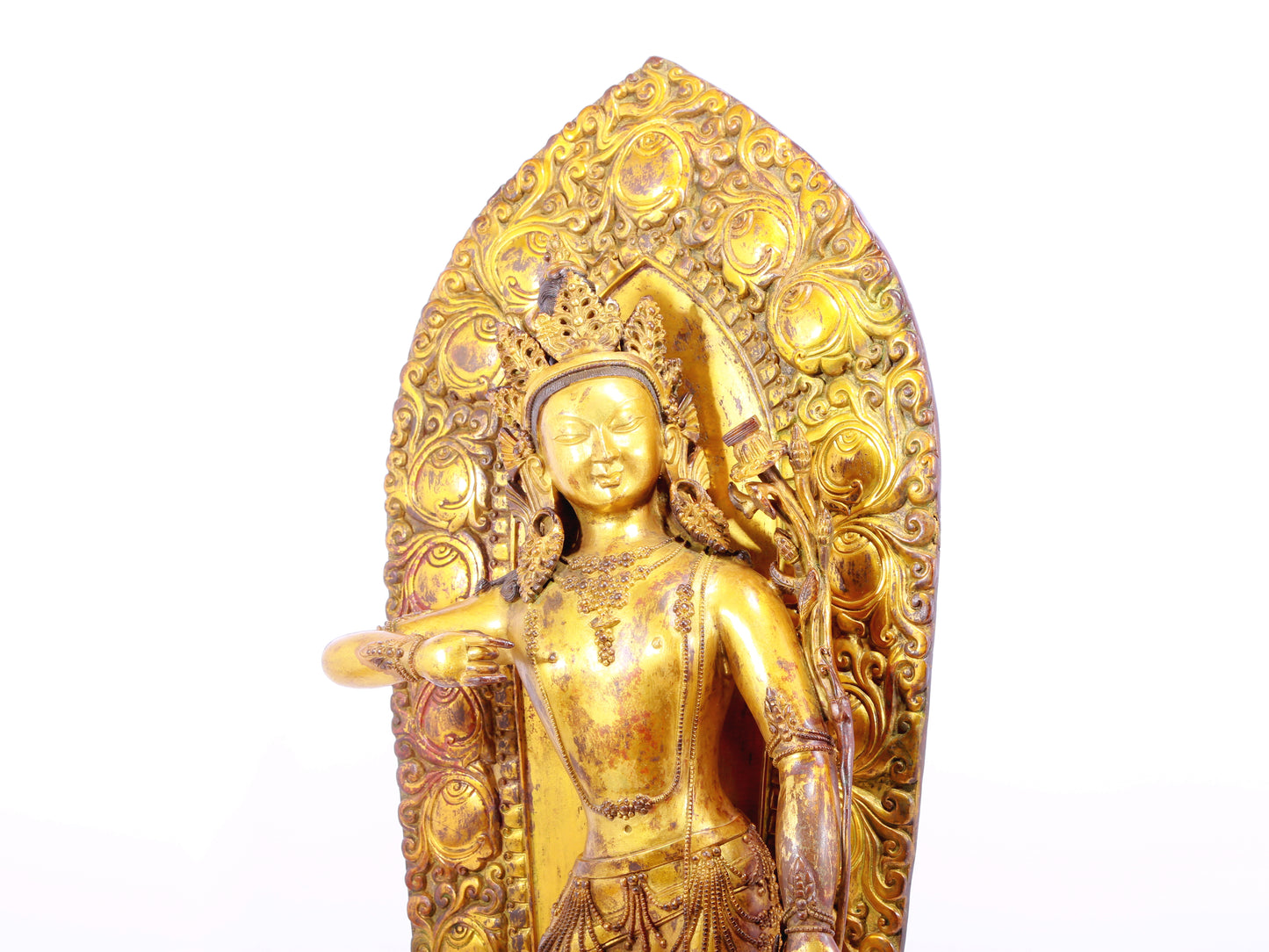 A solemn gilt bronze statue of Tara