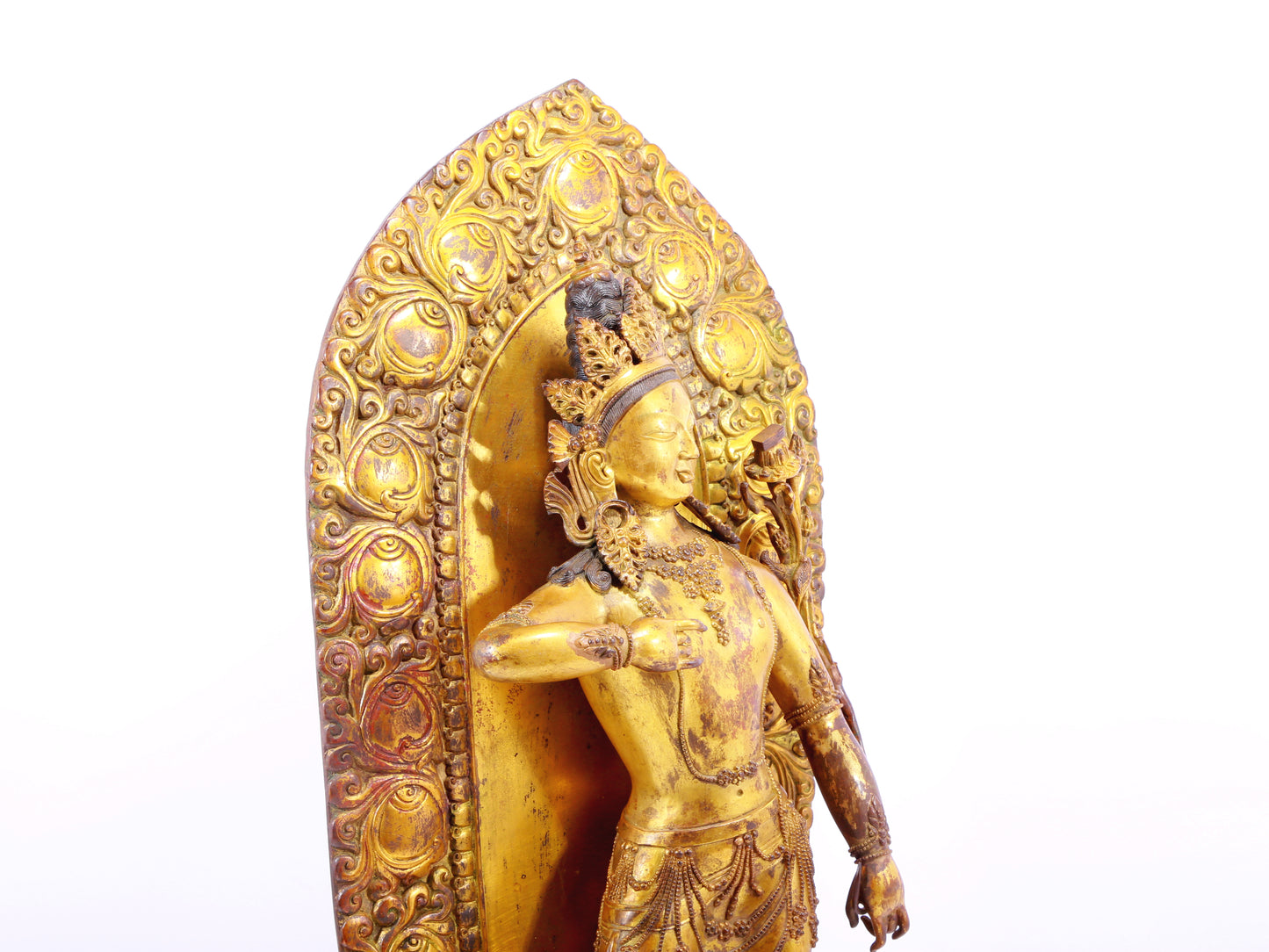 A solemn gilt bronze statue of Tara