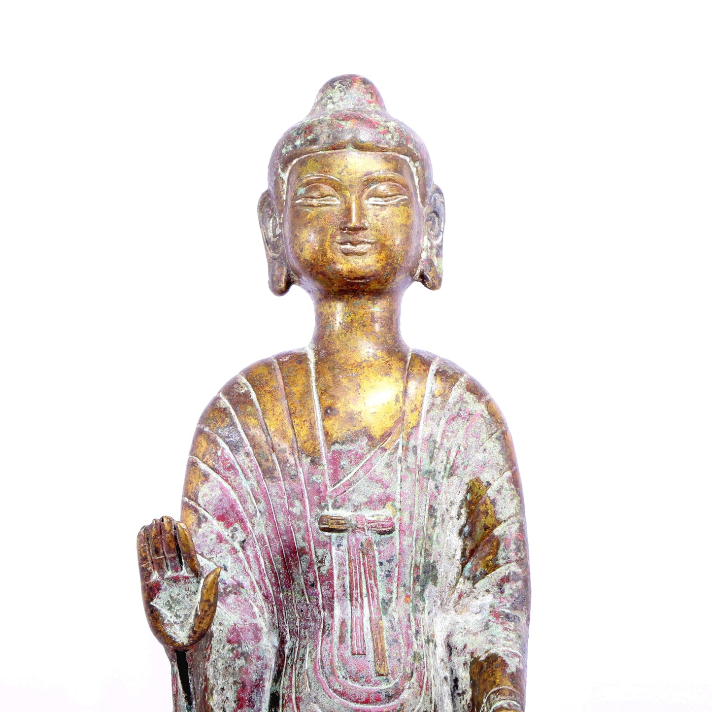 A serene gilt bronze statue of Gautama Buddha