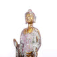 A serene gilt bronze statue of Gautama Buddha