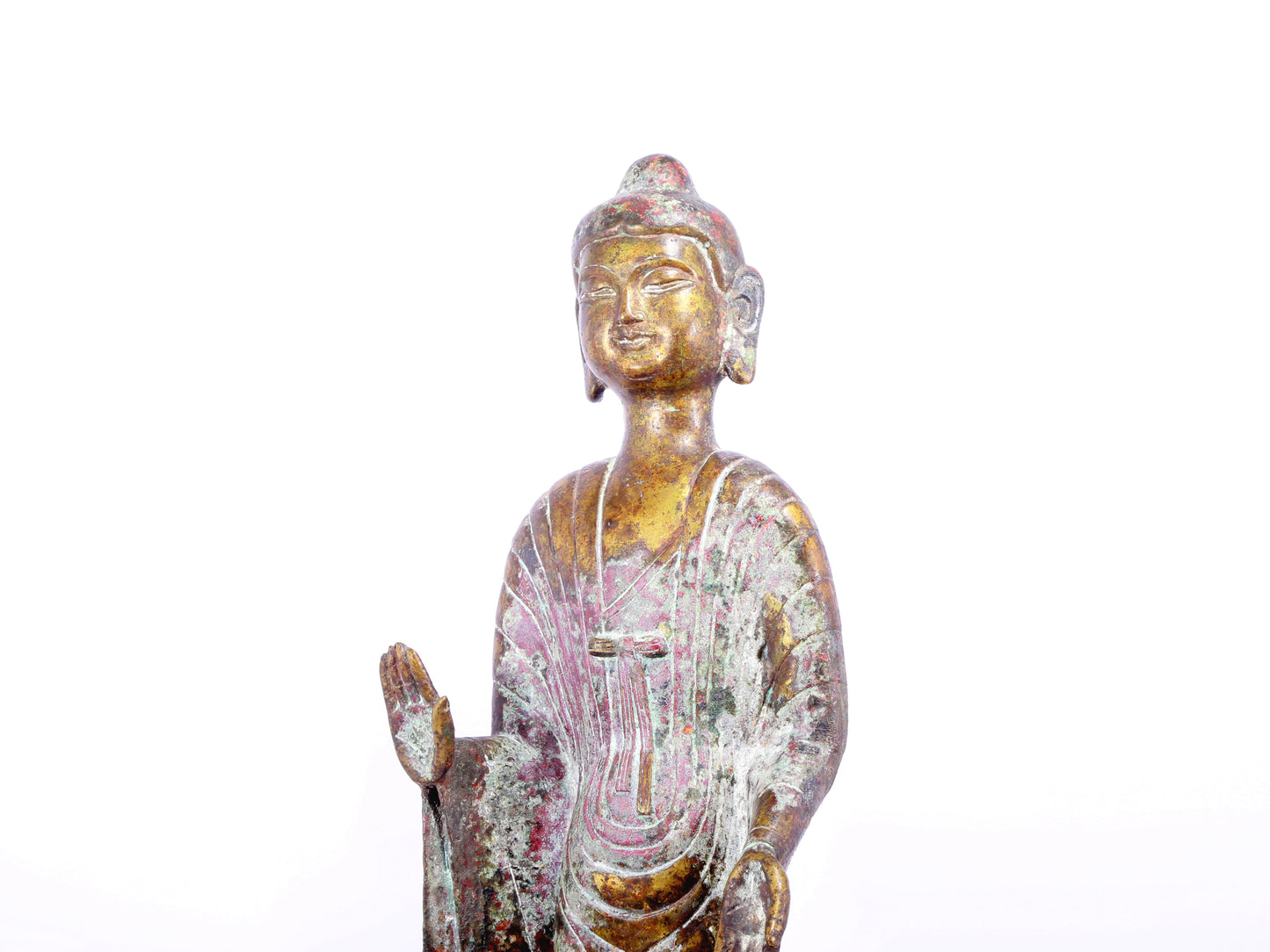 A serene gilt bronze statue of Gautama Buddha