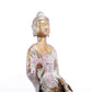 A serene gilt bronze statue of Gautama Buddha