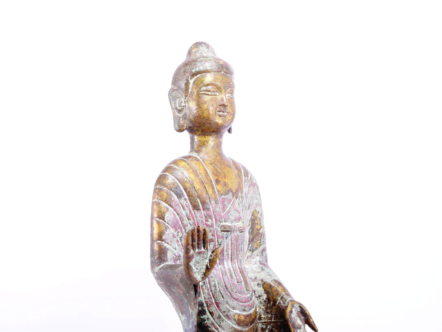 A serene gilt bronze statue of Gautama Buddha