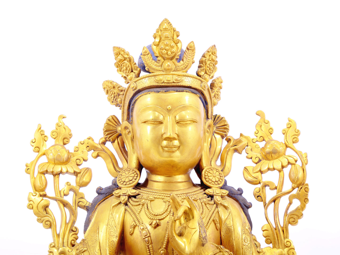 A solemn gilt bronze statue of green Tara