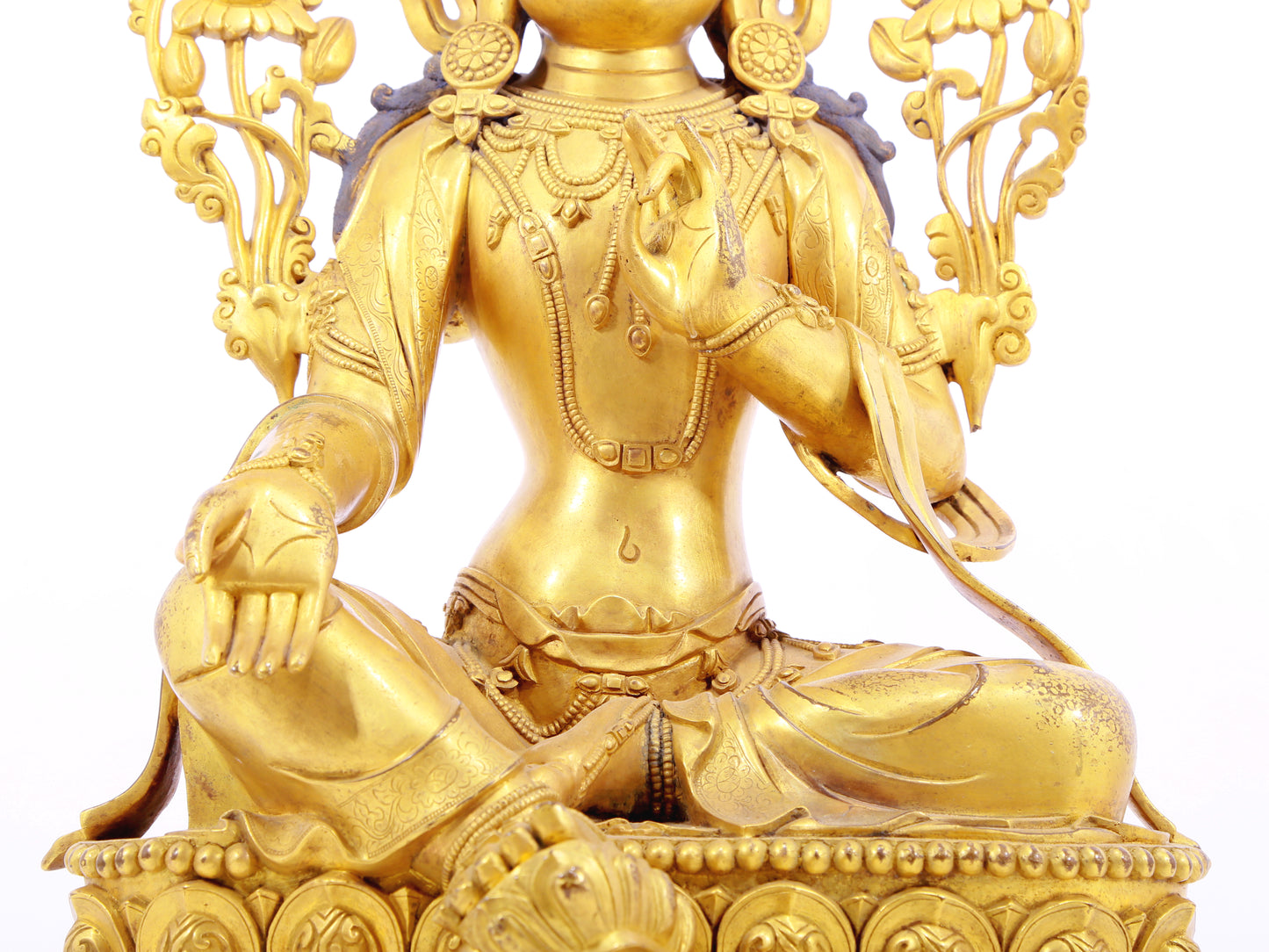 A solemn gilt bronze statue of green Tara