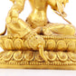 A solemn gilt bronze statue of green Tara