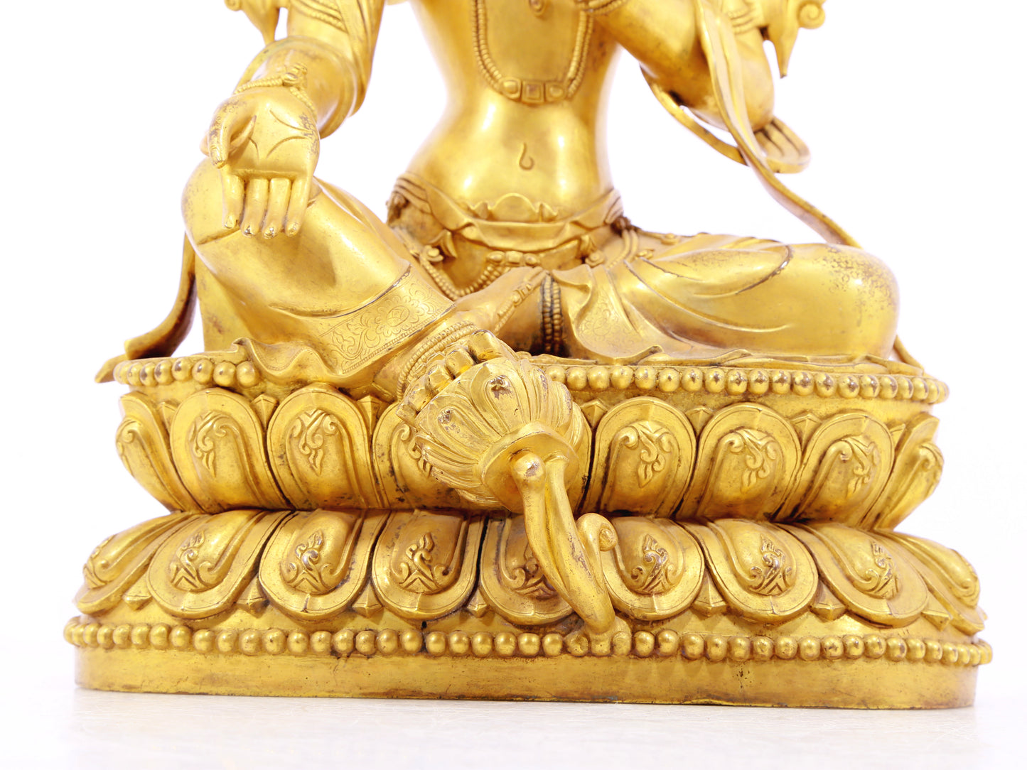 A solemn gilt bronze statue of green Tara