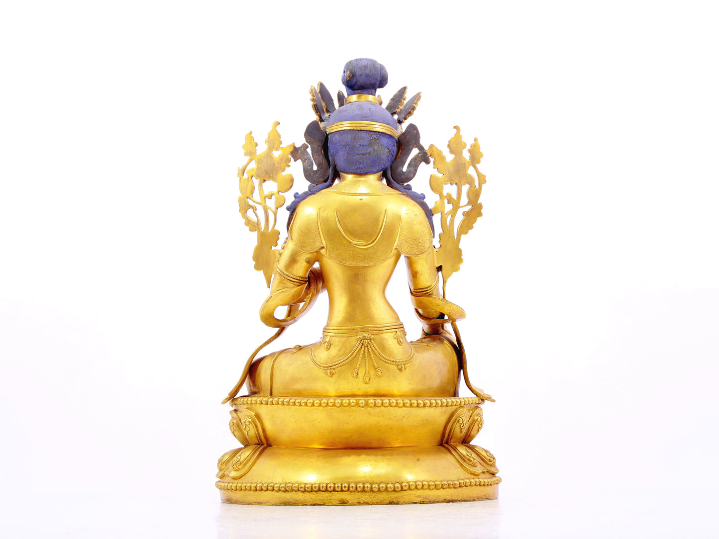 A solemn gilt bronze statue of green Tara