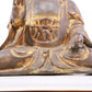 A solemn gilt bronze statue of Gautama Buddha