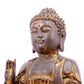 A solemn gilt bronze statue of Gautama Buddha