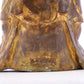 A solemn gilt bronze statue of Gautama Buddha