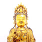 A solemn gilt bronze statue of Guanyin