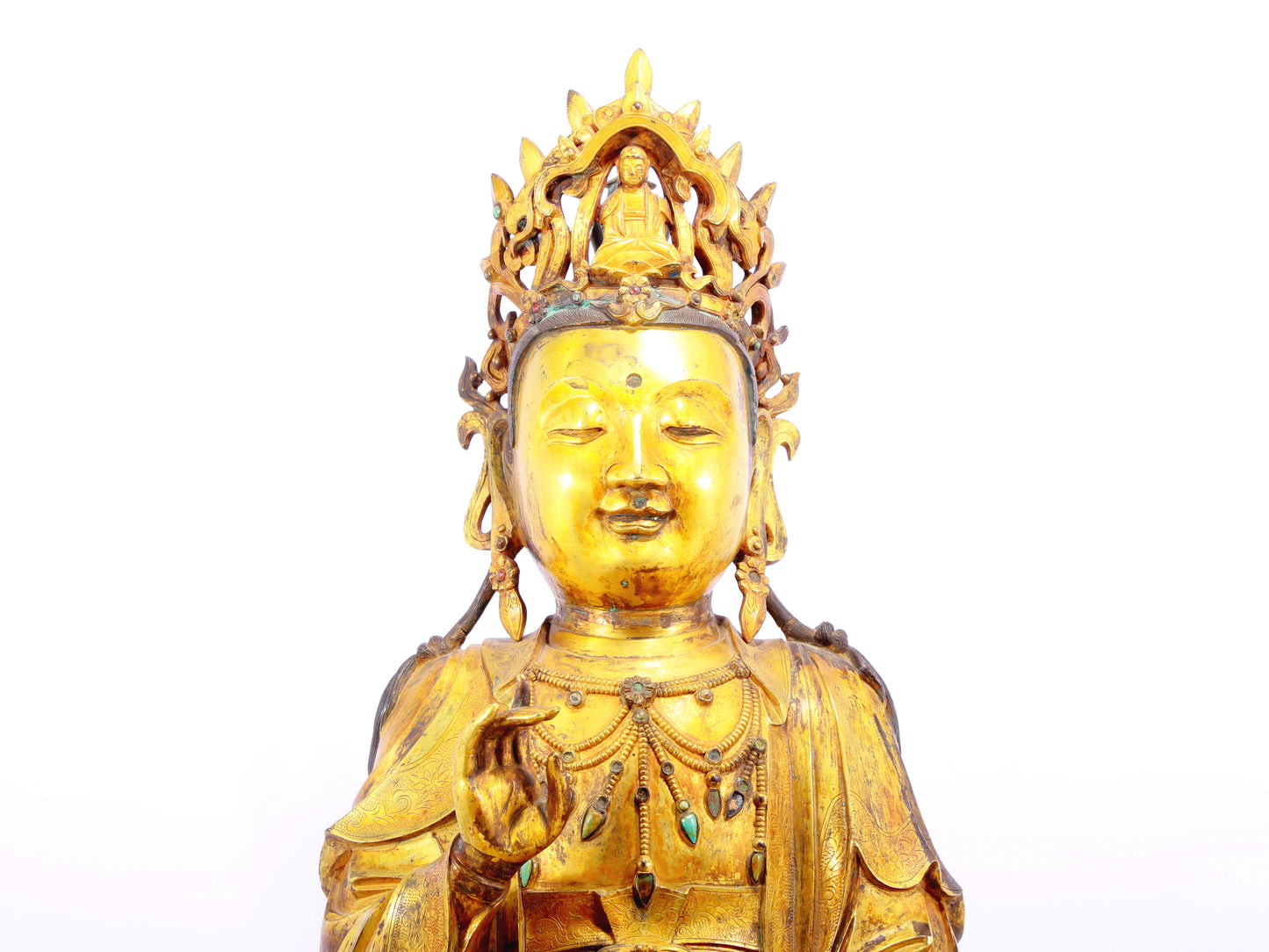 A solemn gilt bronze statue of Guanyin