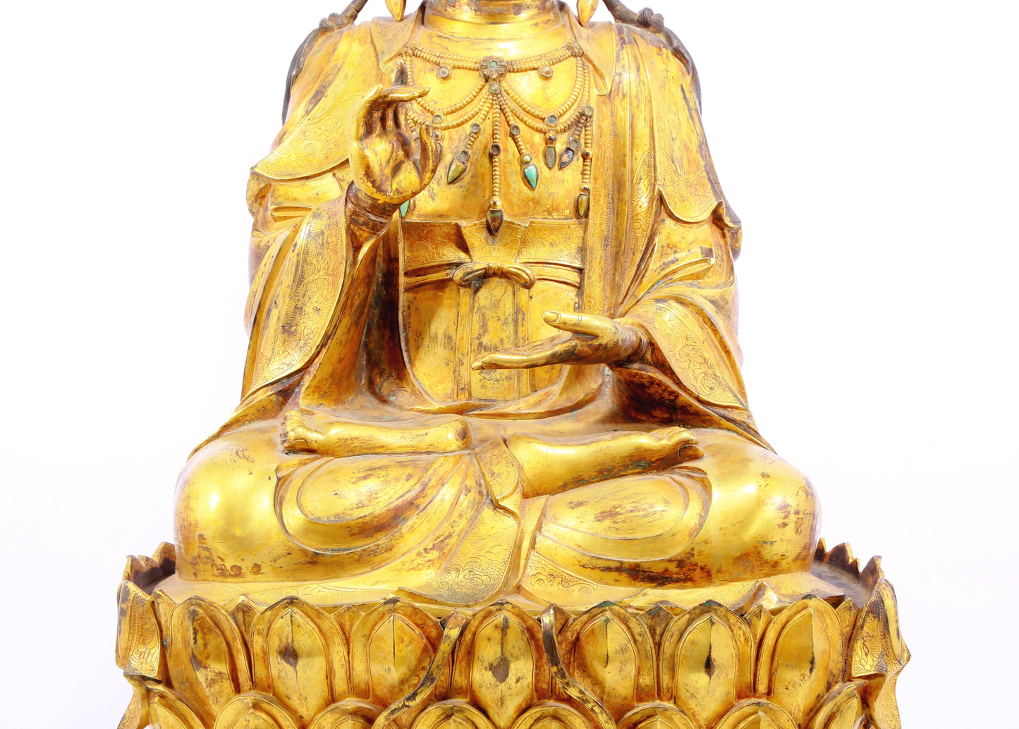 A solemn gilt bronze statue of Guanyin