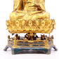 A solemn gilt bronze statue of Guanyin