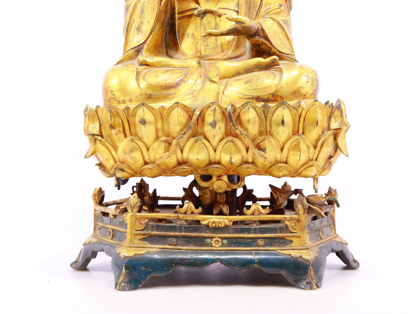 A solemn gilt bronze statue of Guanyin