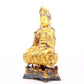 A solemn gilt bronze statue of Guanyin