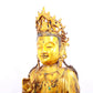 A solemn gilt bronze statue of Guanyin