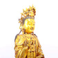 A solemn gilt bronze statue of Guanyin