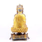 A solemn gilt bronze statue of Guanyin