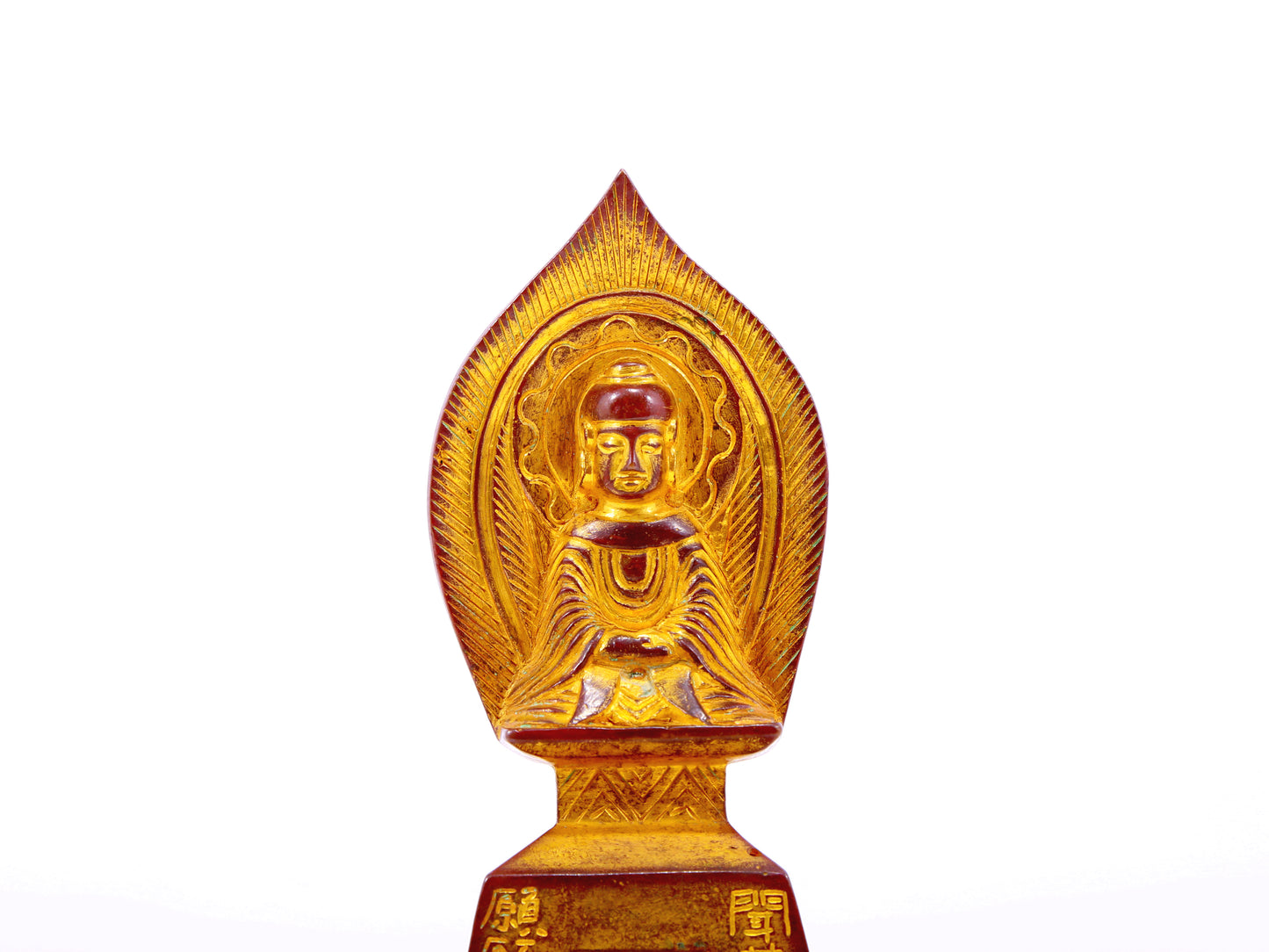 A serene gilt bronze statue of Gautama Buddha