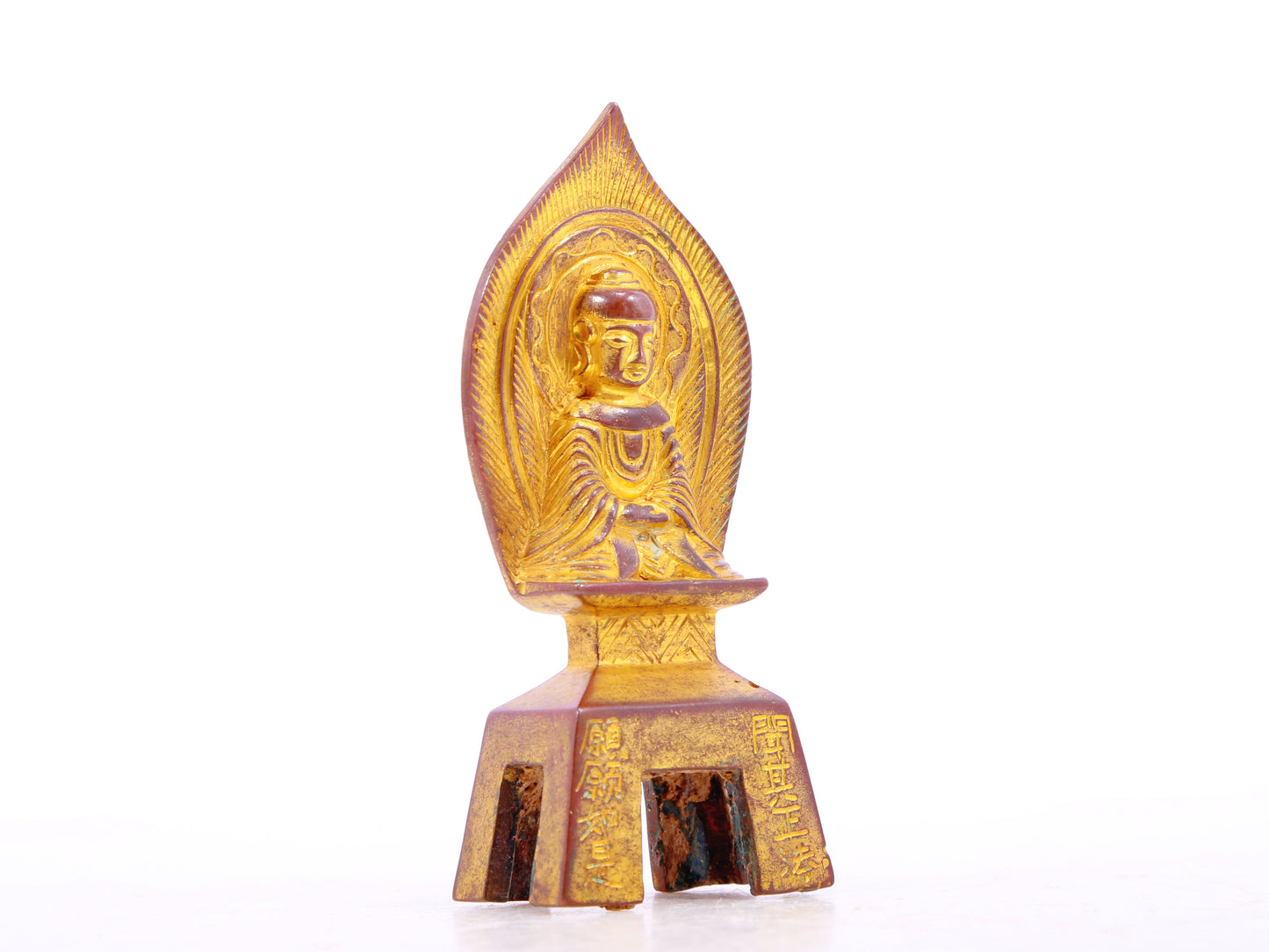 A serene gilt bronze statue of Gautama Buddha