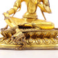 A serene gilt bronze statue of green Tara