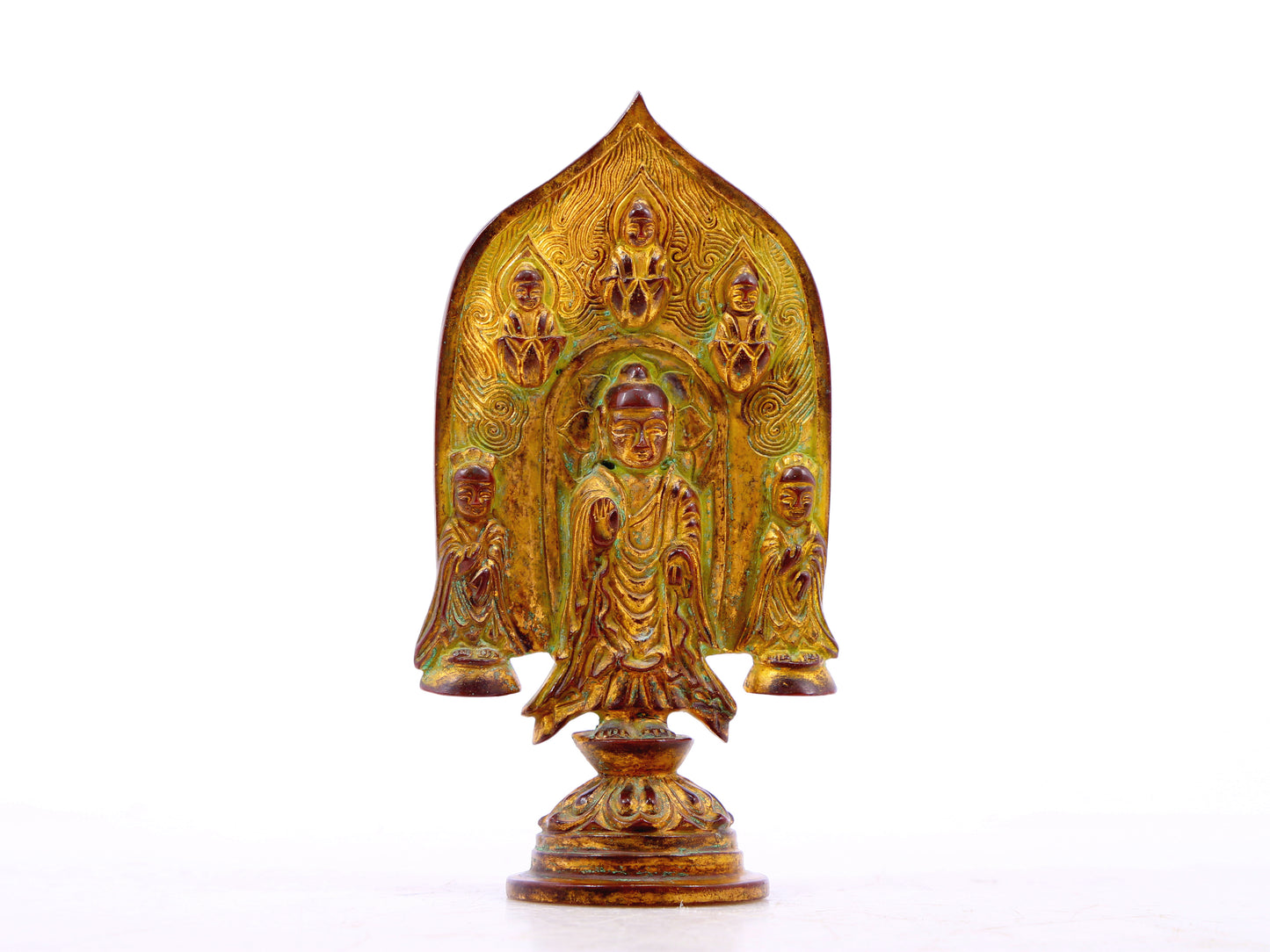 A serene gilt bronze statue of Gautama Buddha