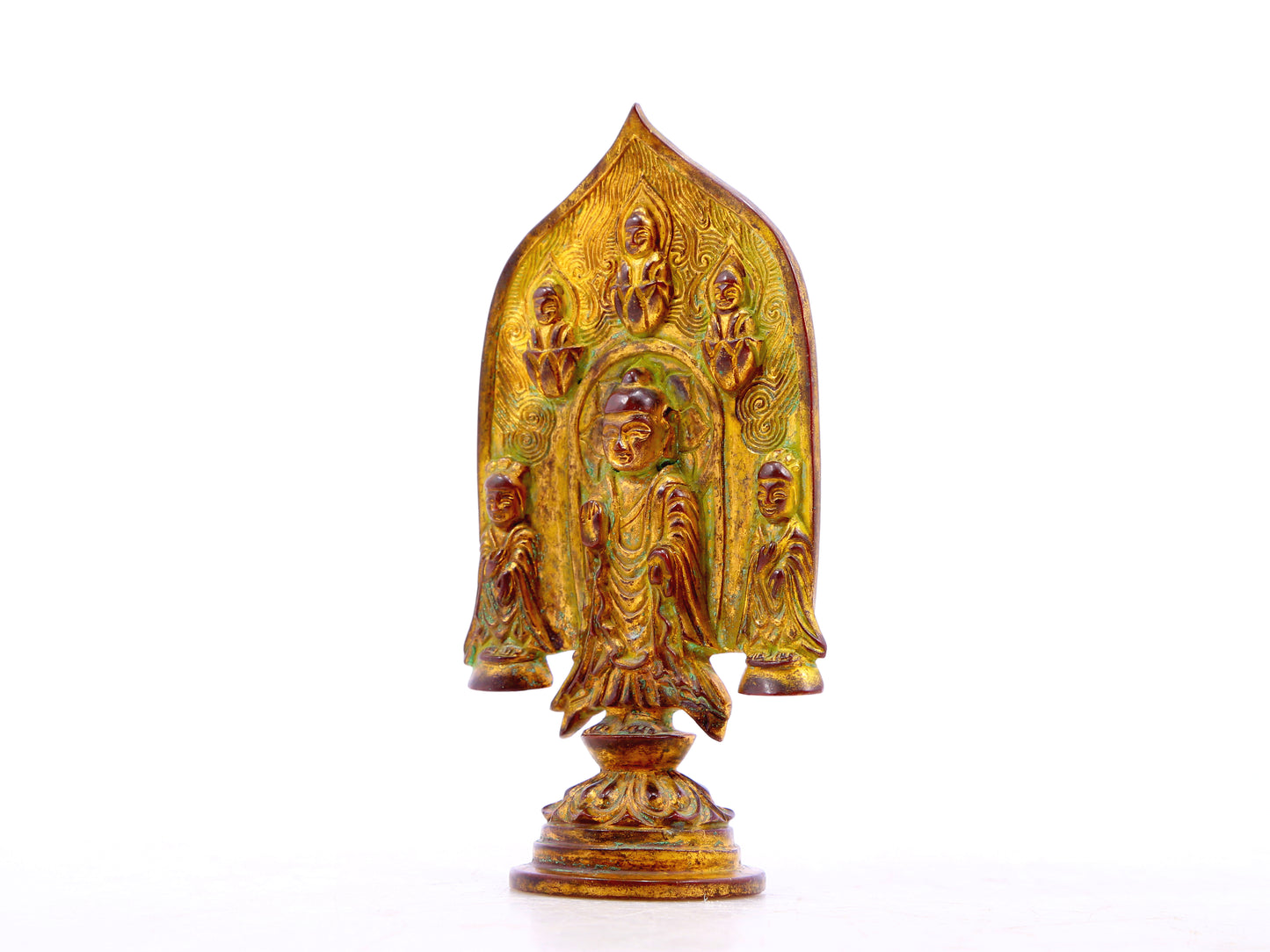 A serene gilt bronze statue of Gautama Buddha