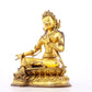 A serene gilt bronze statue of green Tara