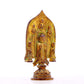 A serene gilt bronze statue of Gautama Buddha