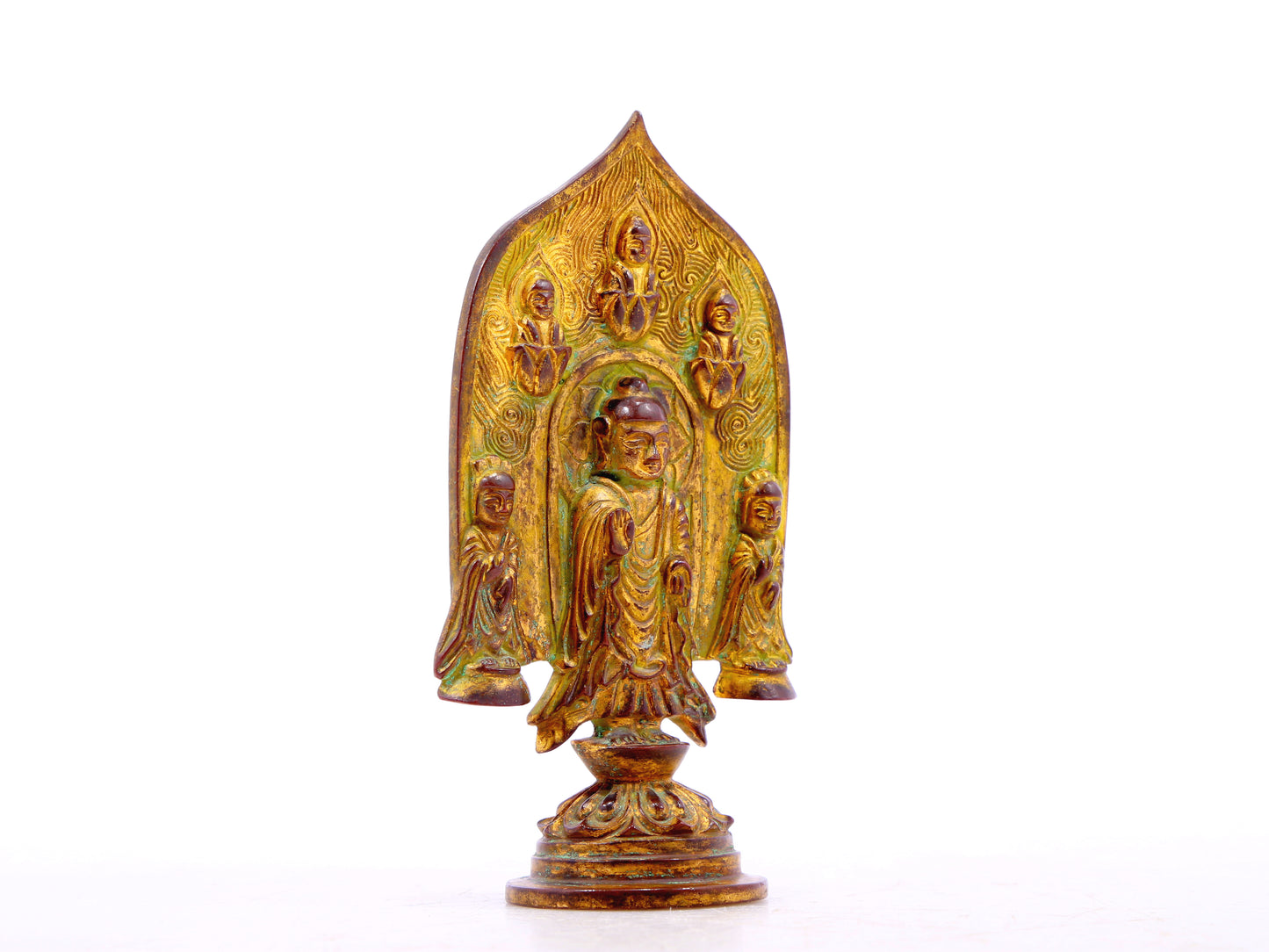 A serene gilt bronze statue of Gautama Buddha