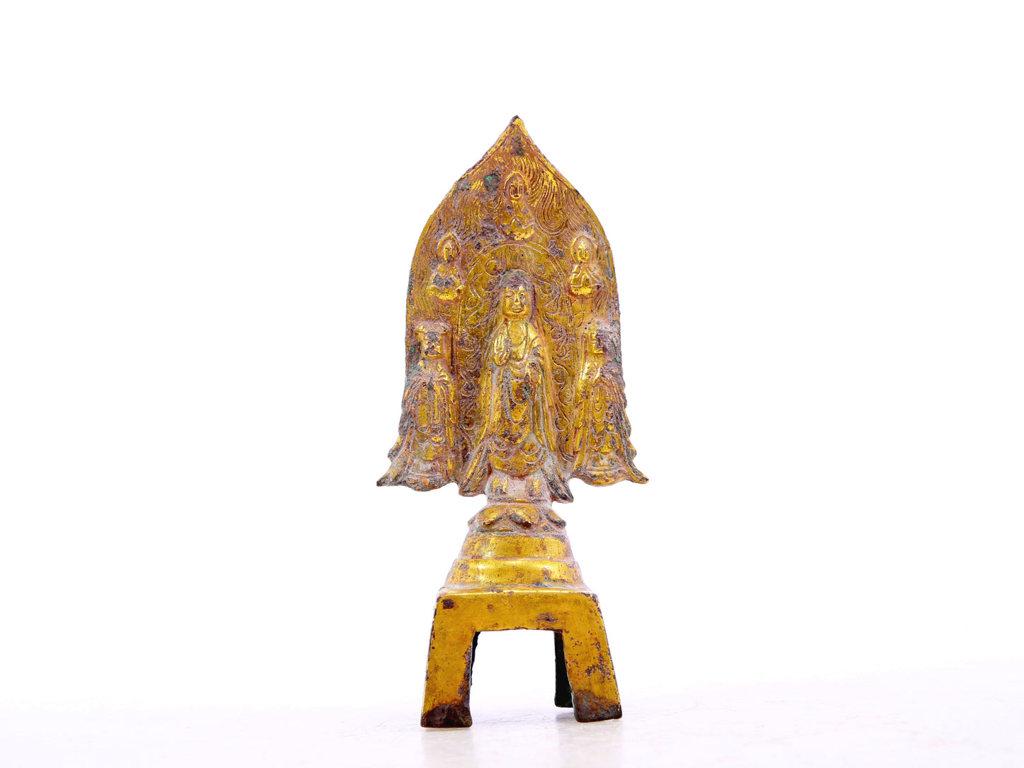 A serene gilt bronze statue of Gautama Buddha