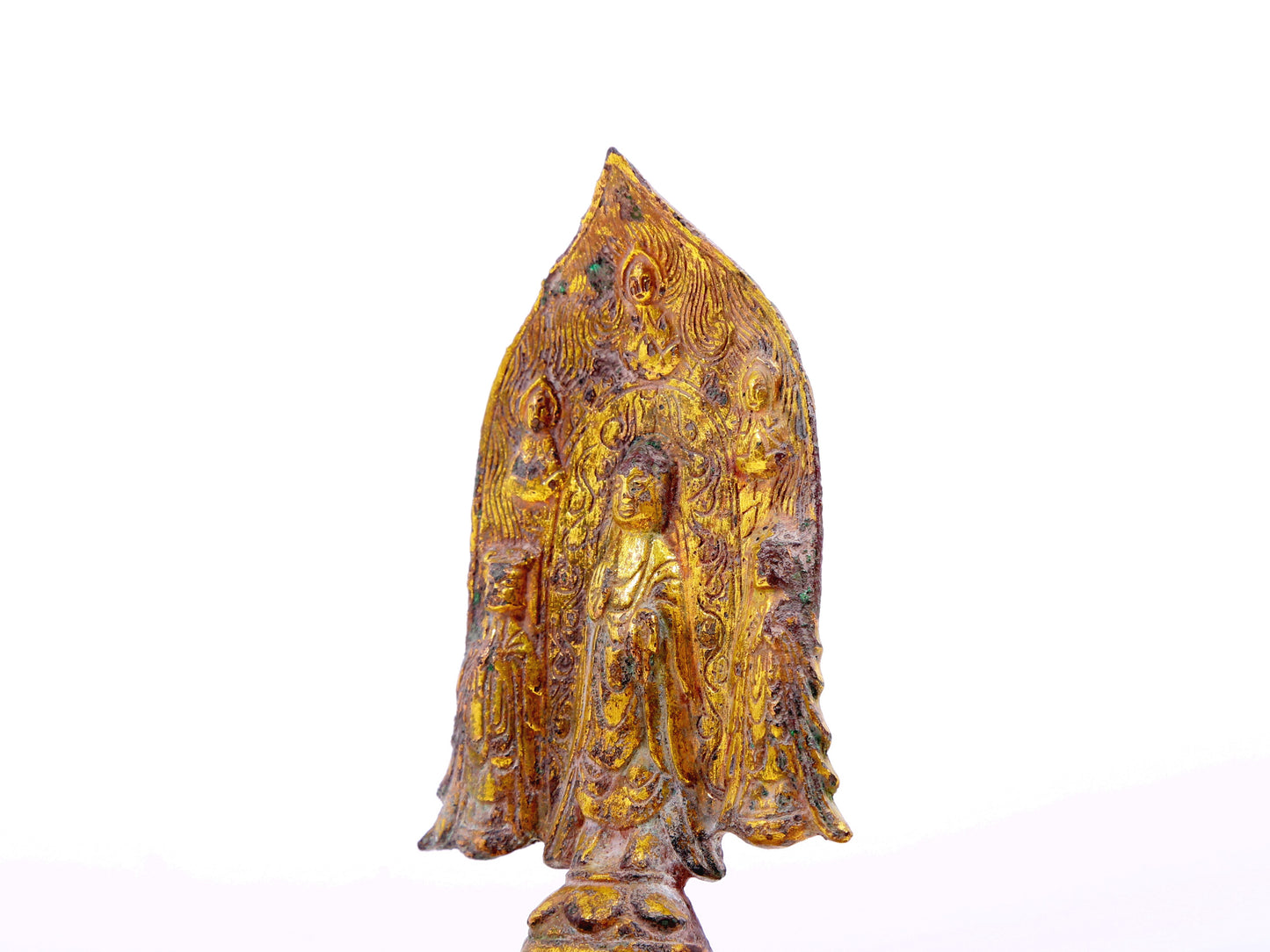 A serene gilt bronze statue of Gautama Buddha