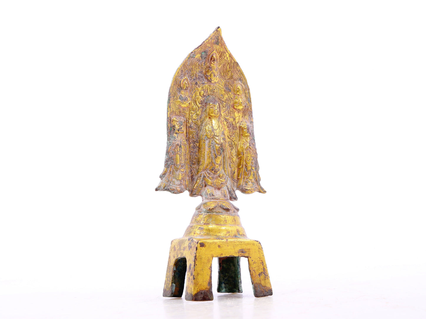 A serene gilt bronze statue of Gautama Buddha